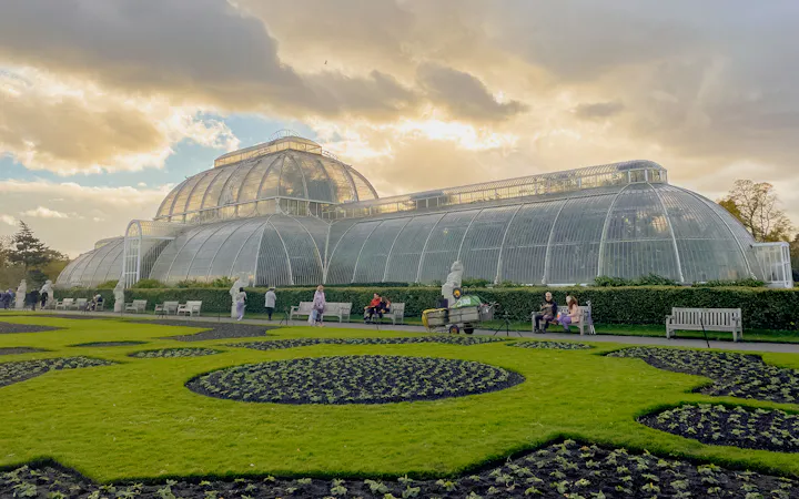 The Palm House glasshouse and lawns at Kew Gardens