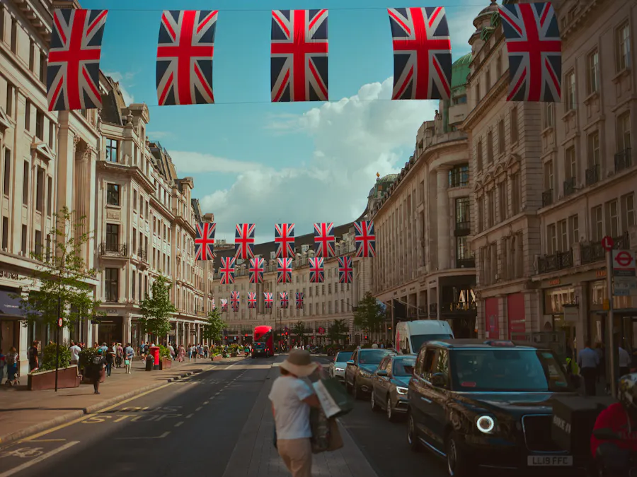 Union Jack flags strung across Regent Street with black cabs below
