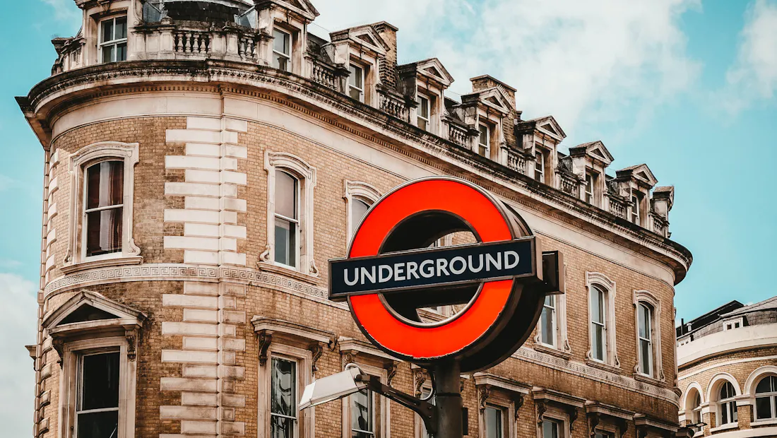A London Underground roundel on a brick station facade